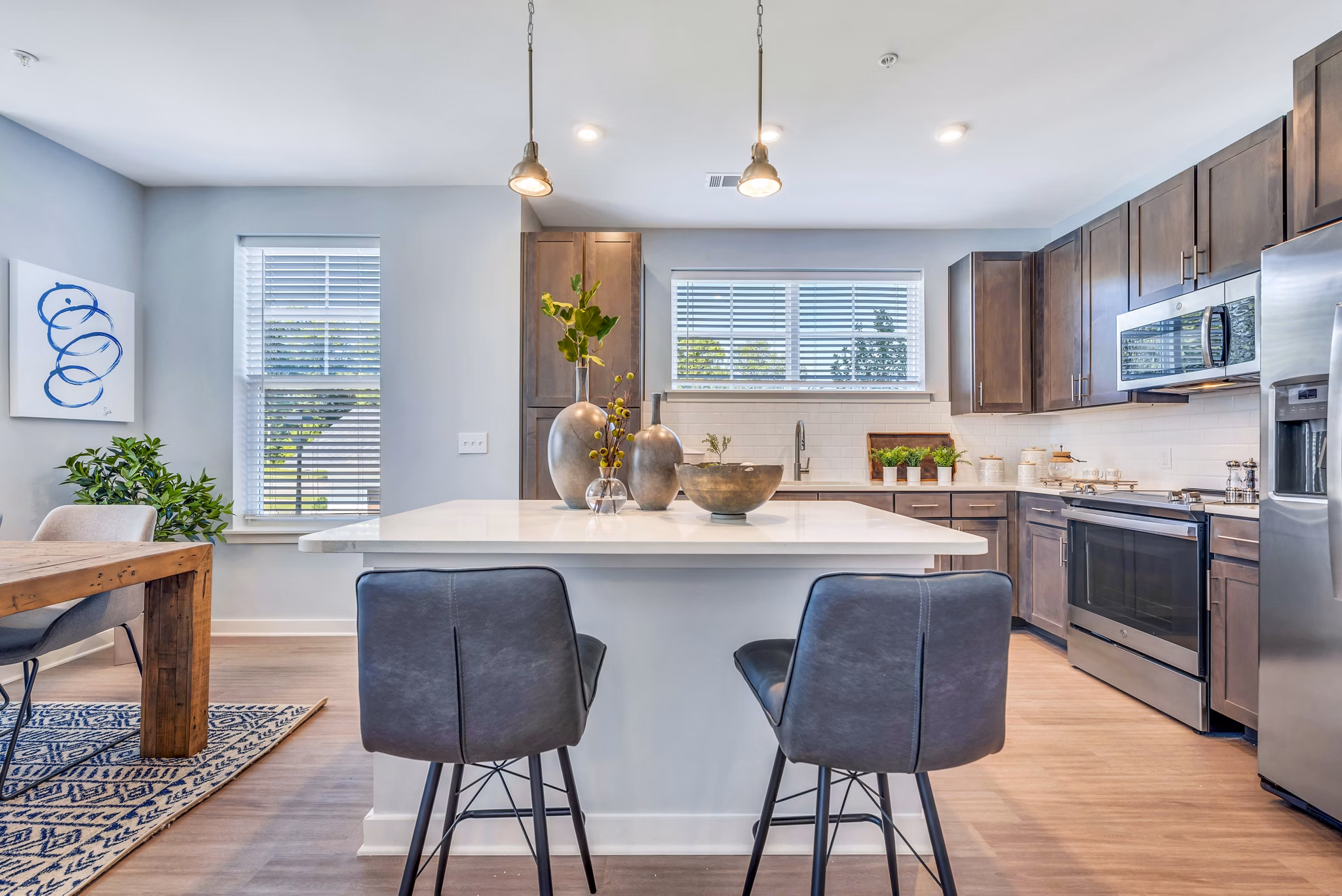 Modern kitchen with stainless steel appliances at Alta Croft Apartments