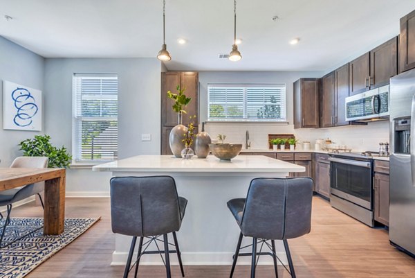 Modern kitchen with stainless steel appliances at Alta Croft Apartments