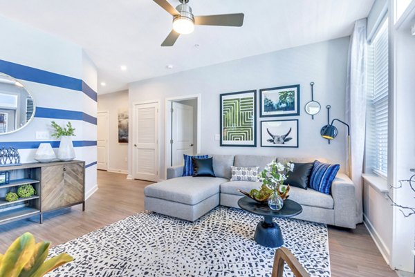 Spacious living room with contemporary furnishings at Alta Croft Apartments