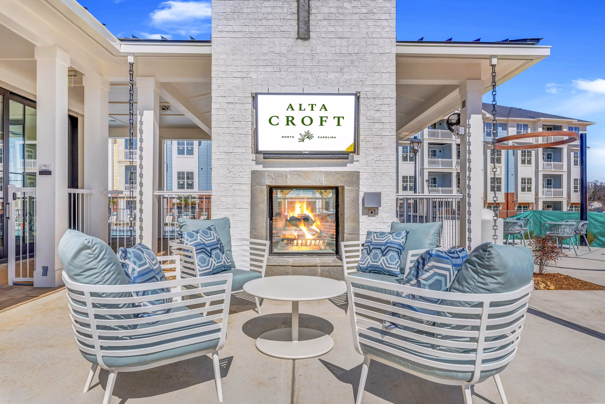 Fire pit on a cozy patio at Alta Croft Apartments offering a serene outdoor space for relaxation and socializing