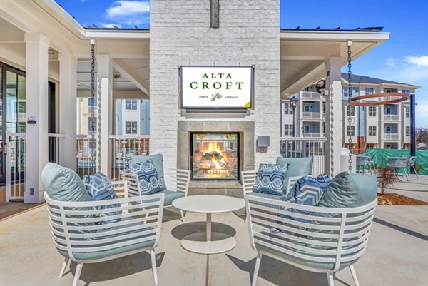 Fire pit on a cozy patio at Alta Croft Apartments offering a serene outdoor space for relaxation and socializing