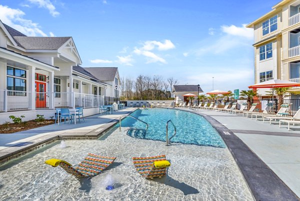 Chic poolside lounge at Alta Croft Apartments offering relaxation and leisure in luxury living environment