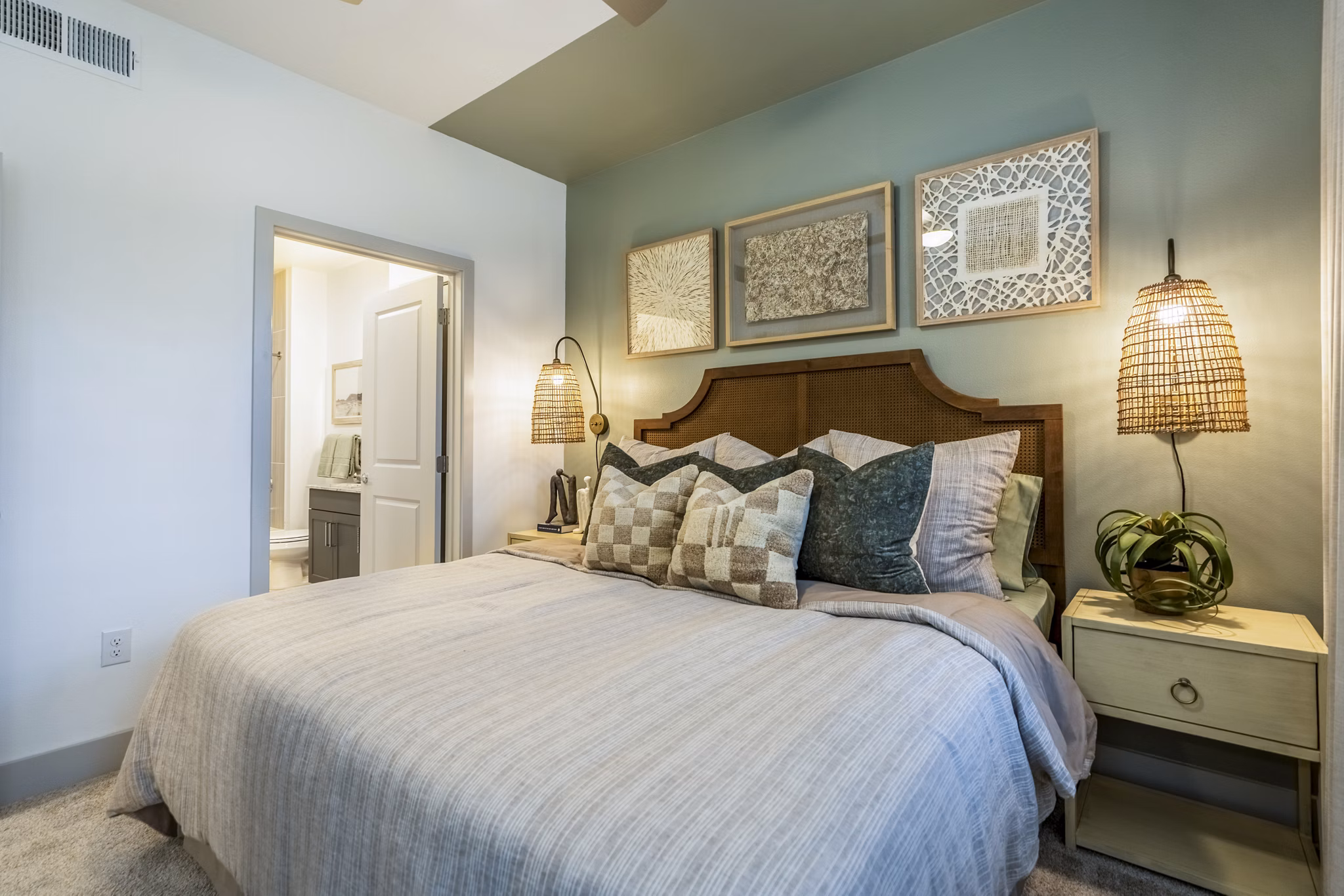 Cozy bedroom with modern furnishings at Alta Cypress Springs Apartments