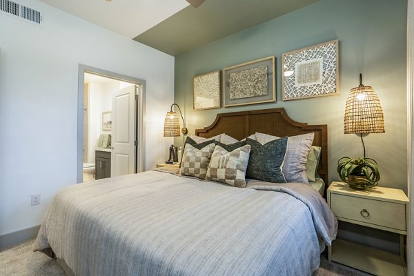 Cozy bedroom with modern furnishings at Alta Cypress Springs Apartments