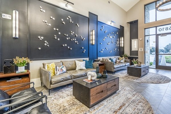 Clubhouse with modern seating and entertainment area at Alta Cypress Springs Apartments