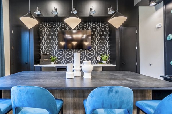 Clubhouse kitchen with modern appliances at Alta Cypress Springs Apartments: luxury Greystar property