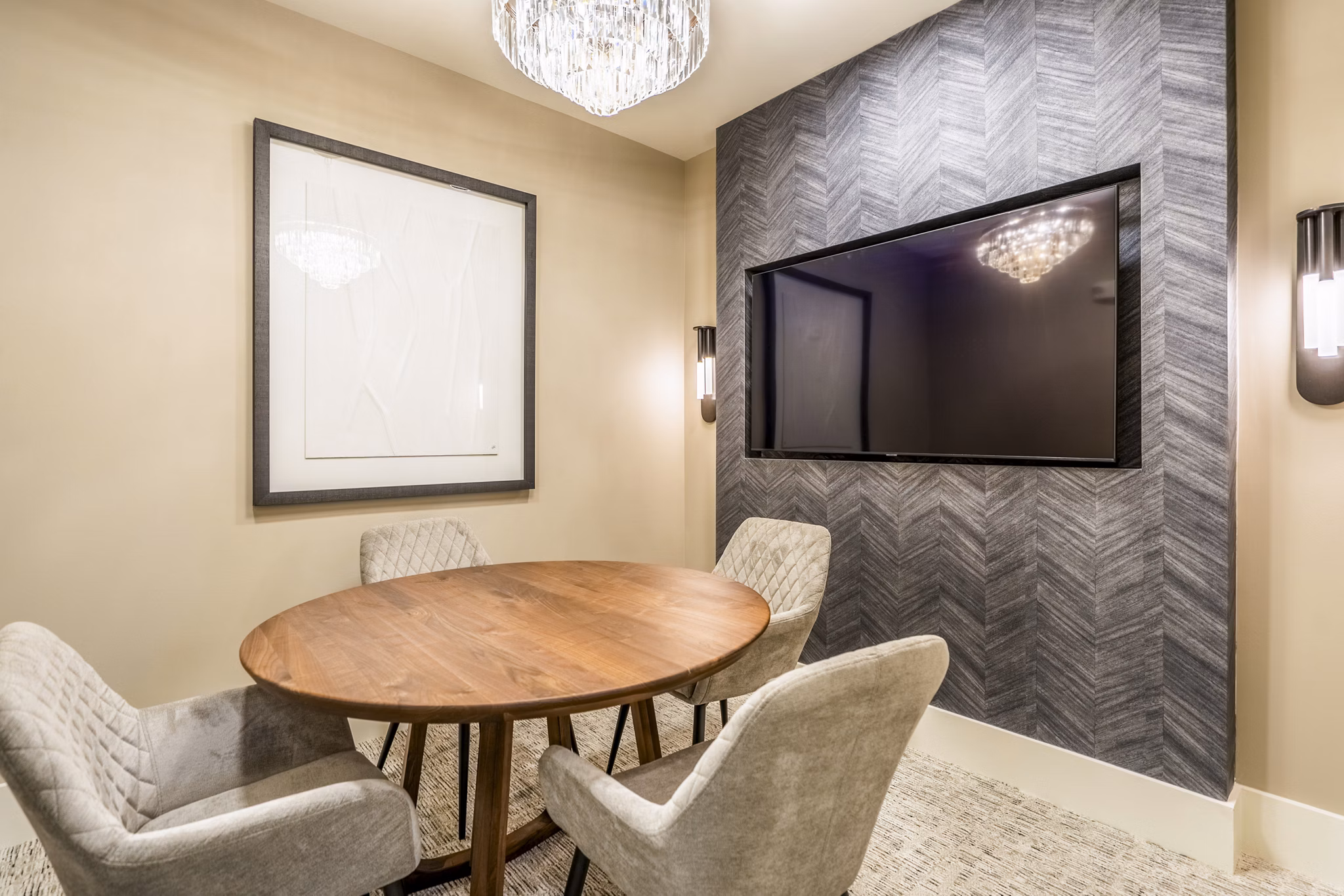Meeting room with modern seating and tech amenities at Alta Cypress Springs Apartments, ideal for gatherings and professional events
