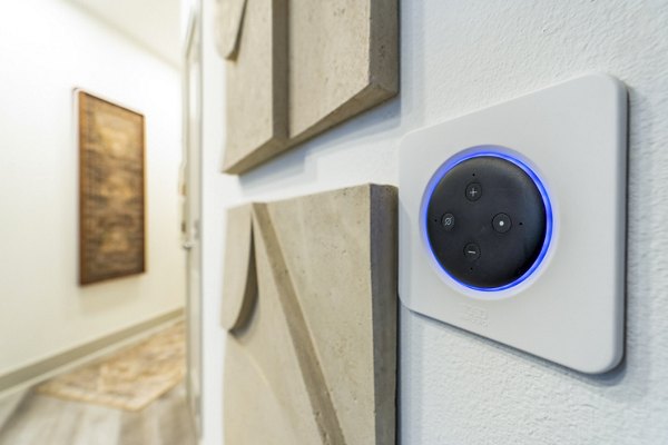 Cozy living room with smart thermostat in Alta Cypress Springs Apartments