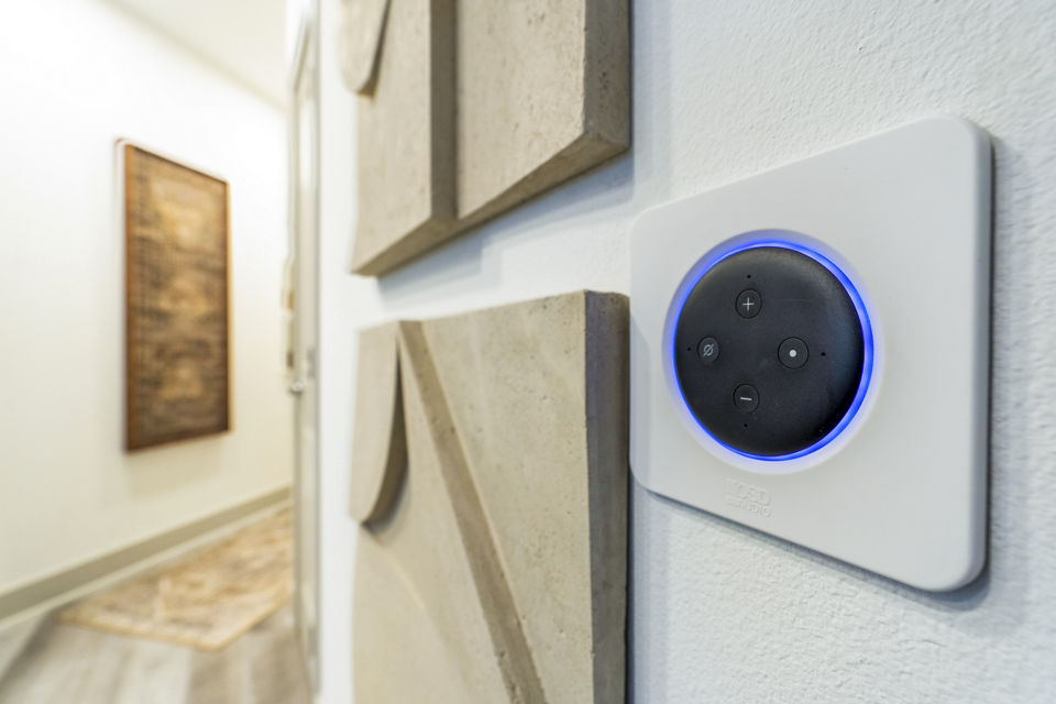 Cozy living room with smart thermostat in Alta Cypress Springs Apartments