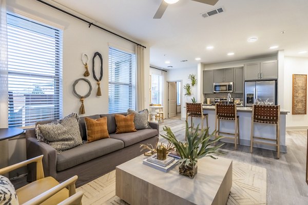 Spacious living room with modern decor in Alta Cypress Springs Apartments, offering luxury amenities and comfort
