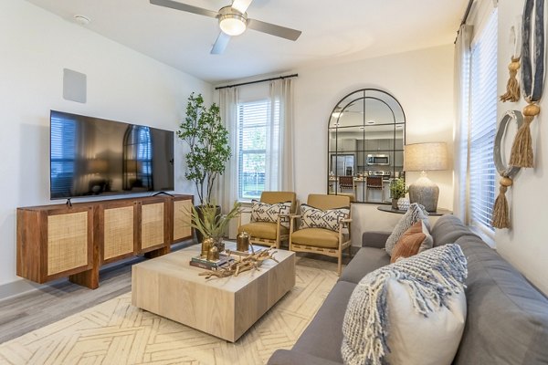 Living room with modern decor and natural light at Alta Cypress Springs Apartments