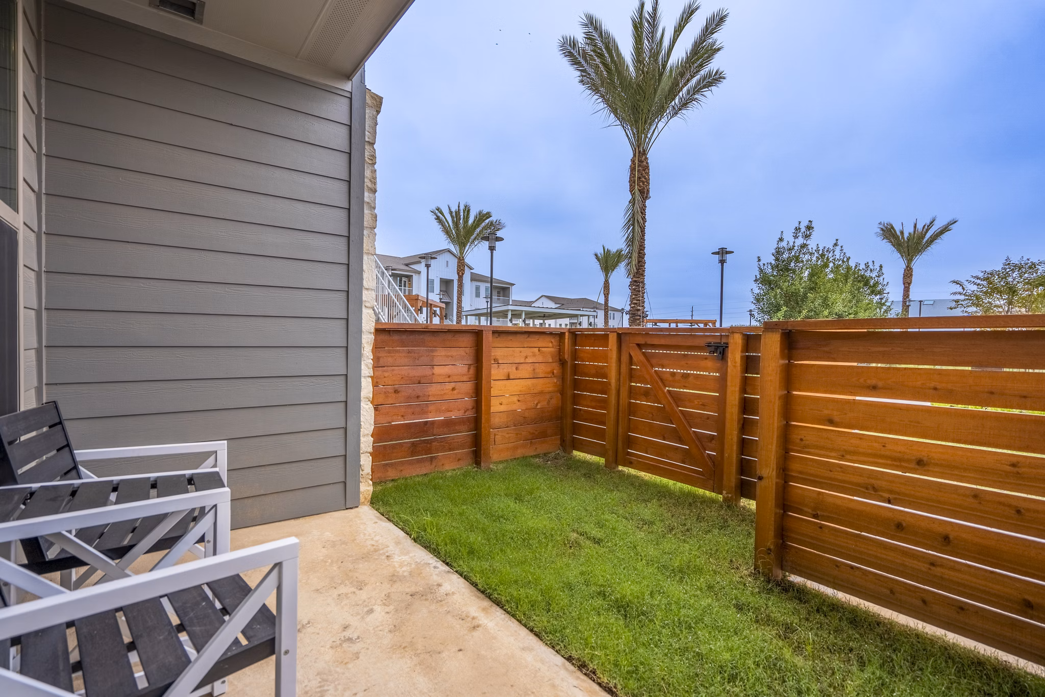 Patio with modern furnishings at Alta Cypress Springs Apartments, ideal space for relaxation and socializing outdoors