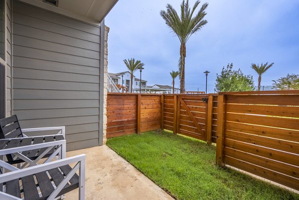 Patio with modern furnishings at Alta Cypress Springs Apartments, ideal space for relaxation and socializing outdoors