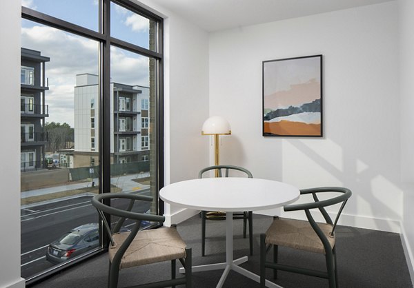 State-of-the-art meeting facility at Alta Davis Apartments with modern seating and presentation technology