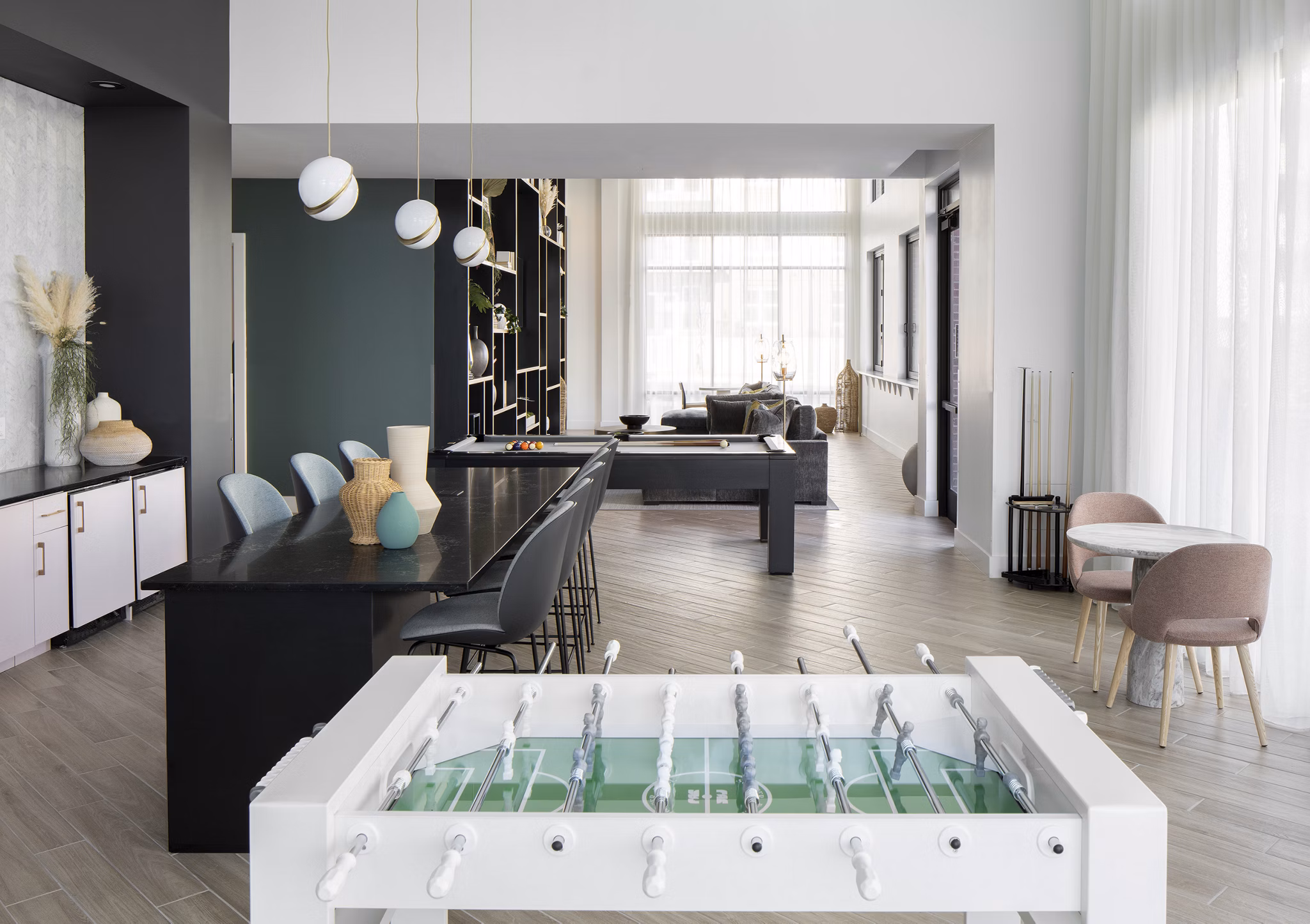 Game room with pool table and video games at Alta Davis Apartments