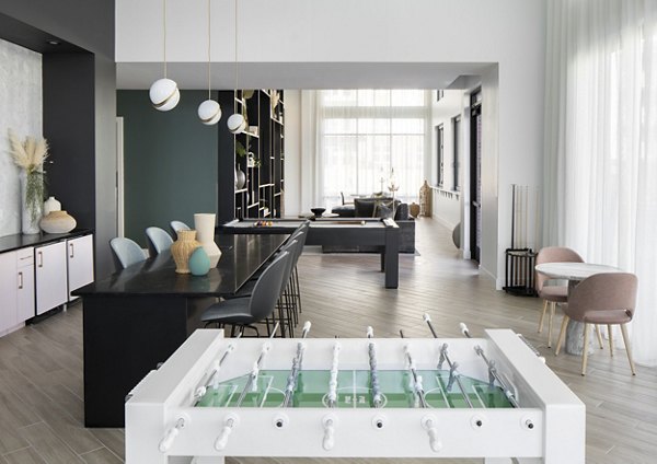 Game room with pool table and video games at Alta Davis Apartments