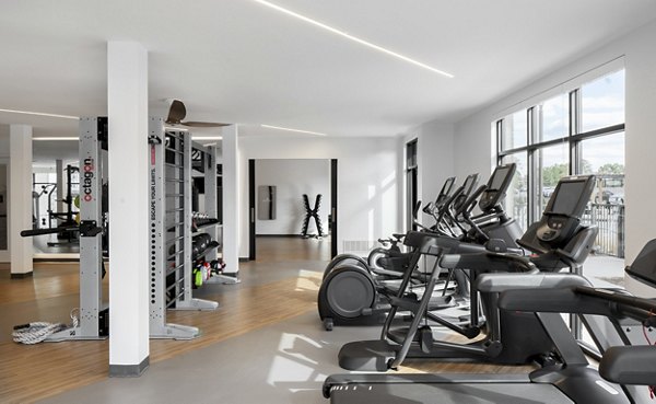 State-of-the-art fitness center with modern equipment at Alta Davis Apartments, offering residents luxury workout experience