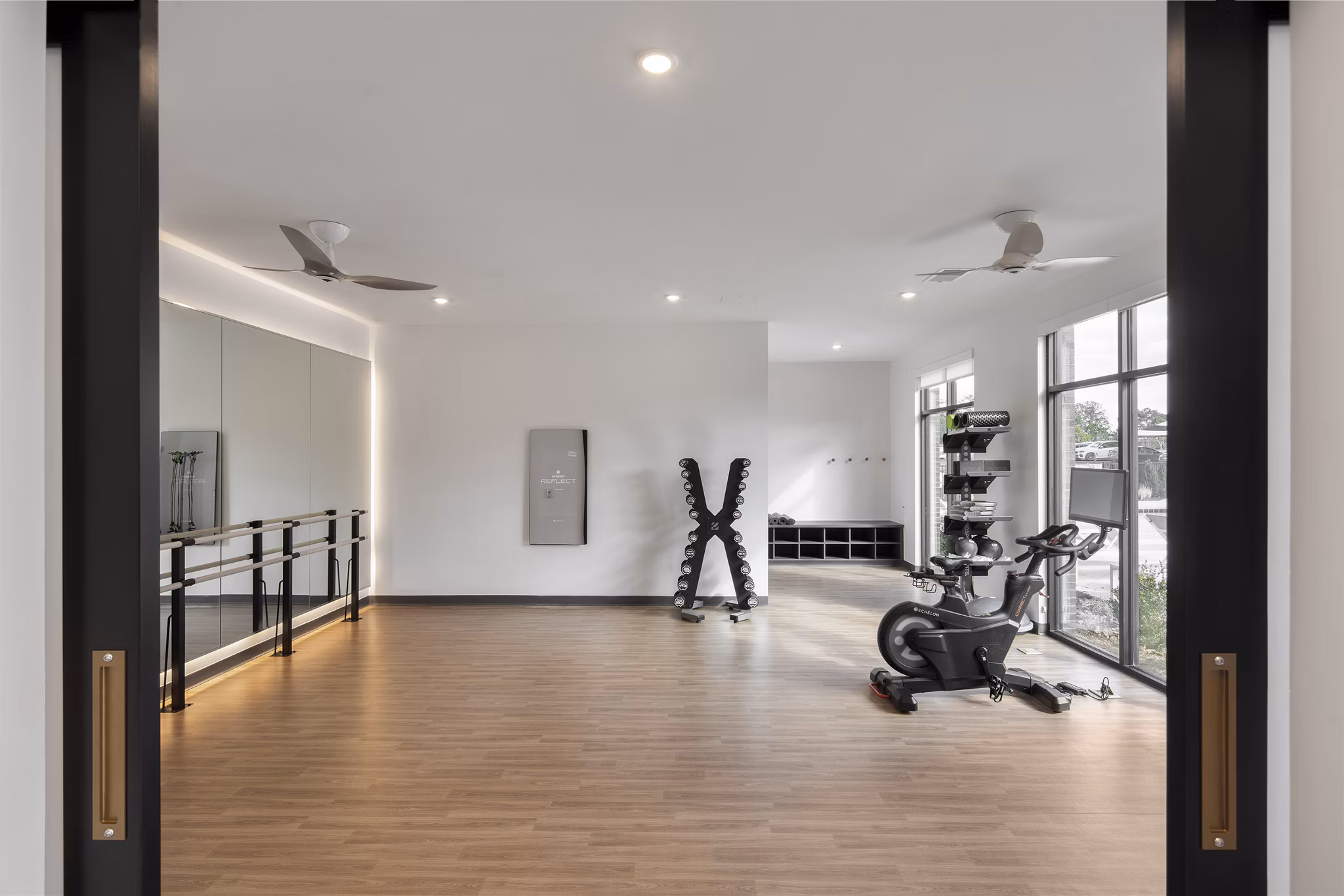Modern fitness center with advanced equipment at Alta Davis Apartments