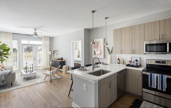 Modern kitchen with stainless steel appliances at Alta Davis Apartments