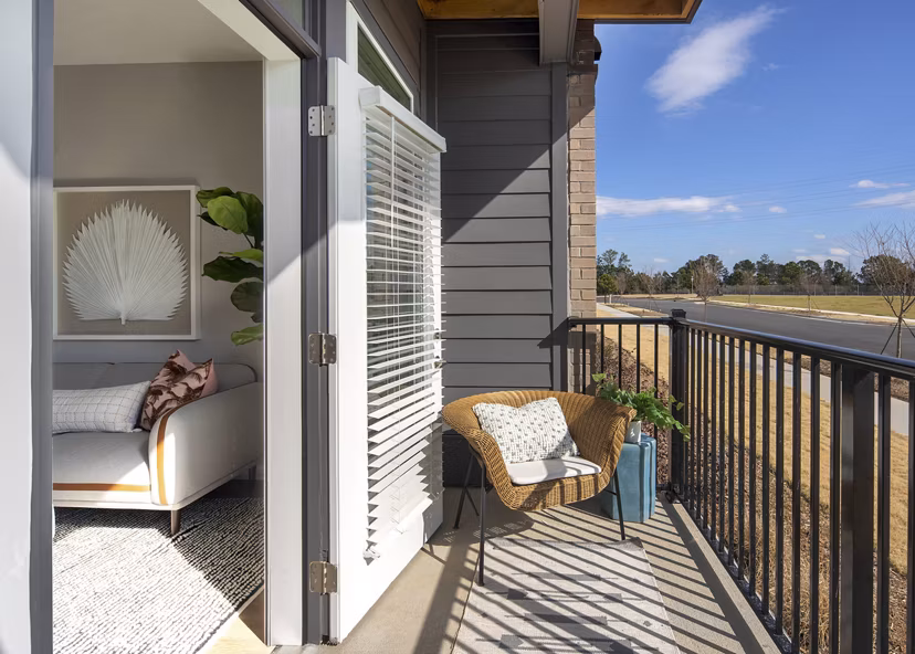Private balcony with modern seating at Alta Davis Apartments