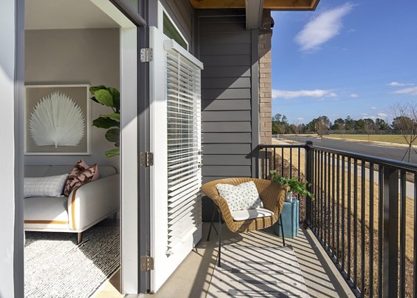 Private balcony with modern seating at Alta Davis Apartments