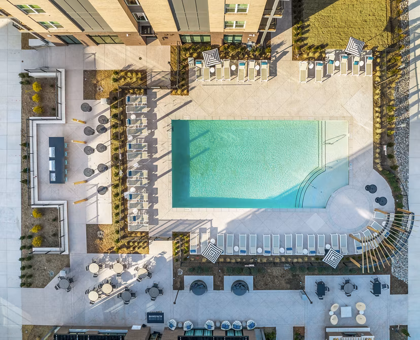 Sun-kissed outdoor pool at Alta Davis Apartments offering luxury living experiences