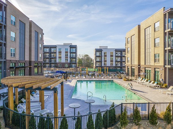 Luxurious resort-style pool at Alta Davis Apartments, perfect for relaxing and enjoying upscale amenities in a vibrant community setting