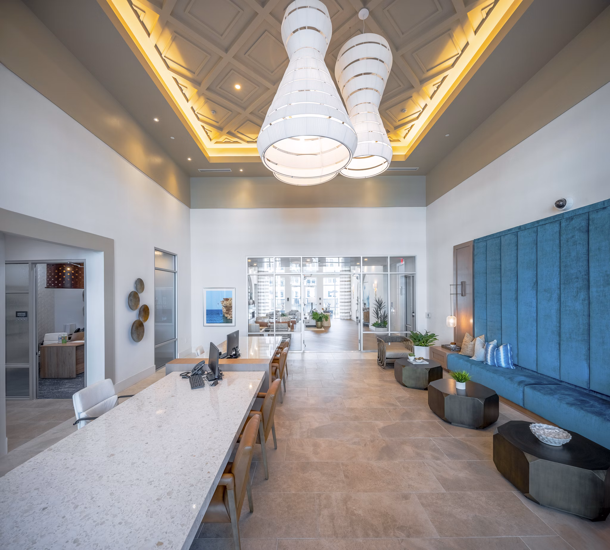 Chic clubhouse with modern decor at Alta Deco Apartments, perfect for socializing and events in a luxurious setting