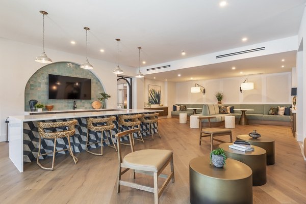 Clubhouse featuring modern seating and entertainment spaces at Alta Deco Apartments luxury community