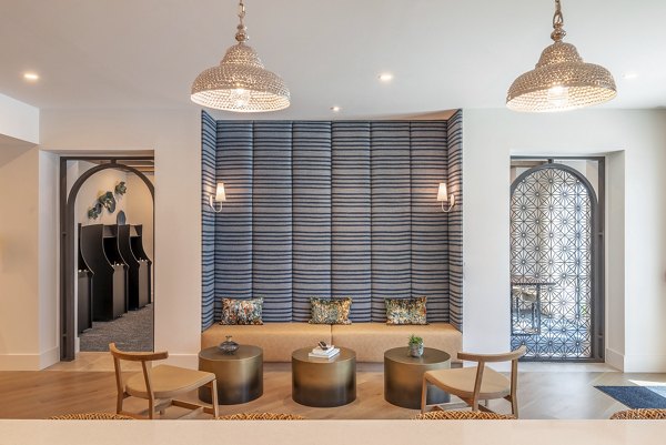 Stylish clubhouse featuring modern seating and entertainment areas at Alta Deco Apartments