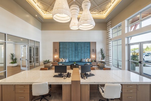 Modern clubhouse with elegant decor at Alta Deco Apartments offering a sophisticated space for social gatherings and events