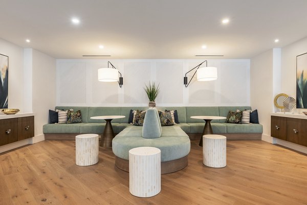 Clubhouse with modern furnishings at Alta Deco Apartments, a Greystar luxury community