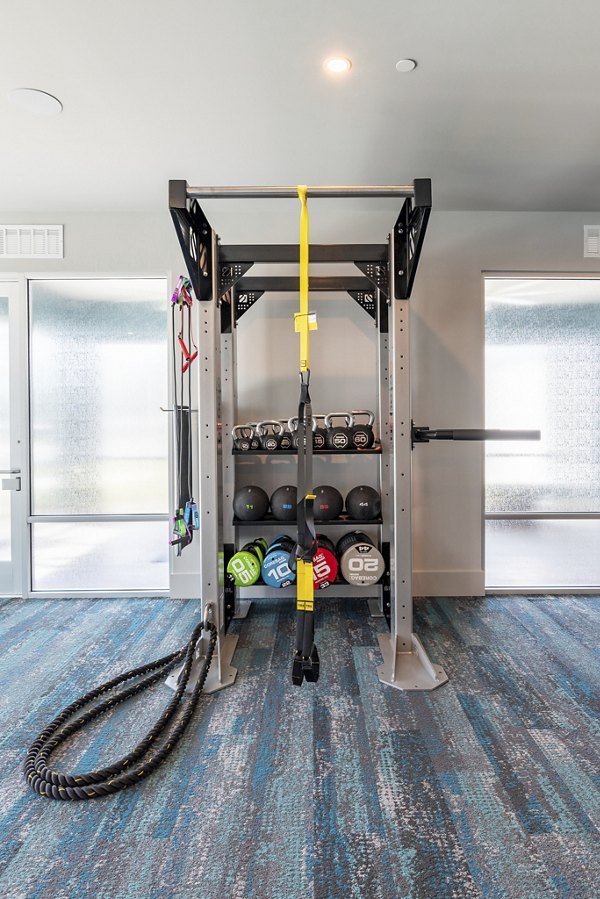 Fitness center with modern equipment at Alta Deco Apartments for active lifestyles