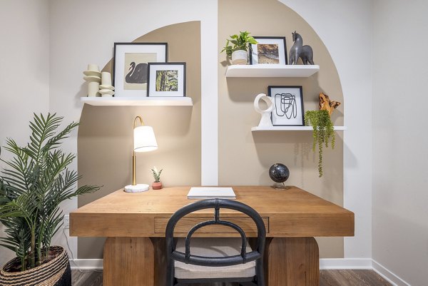 Spacious kitchen with modern appliances and granite countertops at Alta Deco Apartments