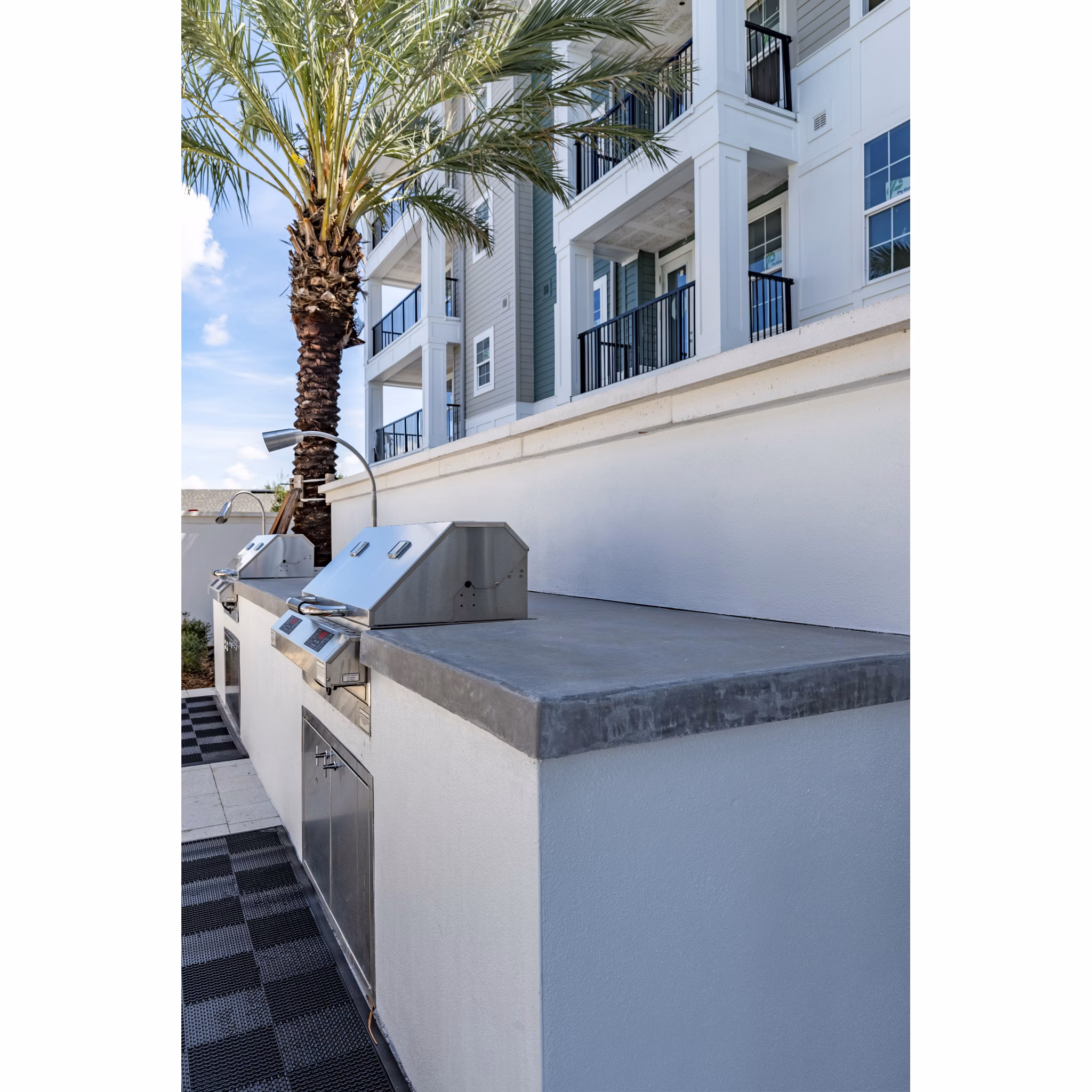 Recreation area with modern seating and games at Alta Deco Apartments