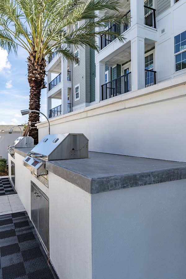 Recreation area with modern seating and games at Alta Deco Apartments