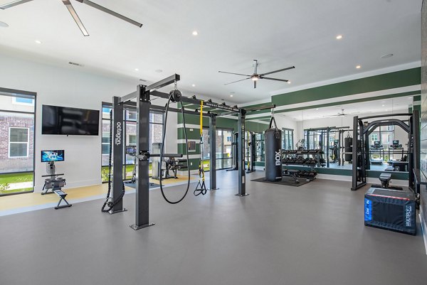 Modern fitness center with state-of-the-art equipment at Alta Denton Station Apartments