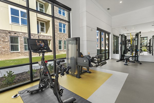 Modern fitness center with advanced equipment at Alta Denton Station Apartments