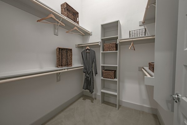 Modern bedroom with stylish decor at Alta at the Farm Apartments