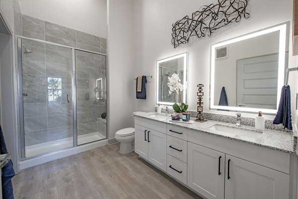 Modern bathroom with sleek fixtures in Alta at the Farm Apartments, luxury living