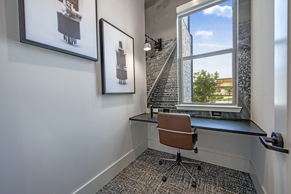 Modern clubhouse featuring cozy seating and community spaces at Alta at the Farm Apartments