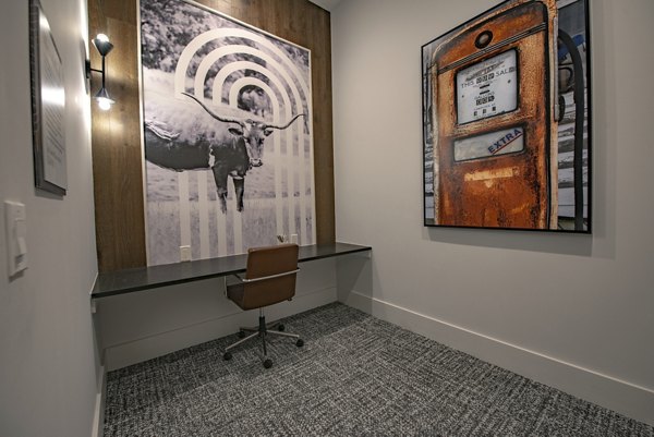 Clubhouse featuring modern design and seating areas at Alta at the Farm Apartments