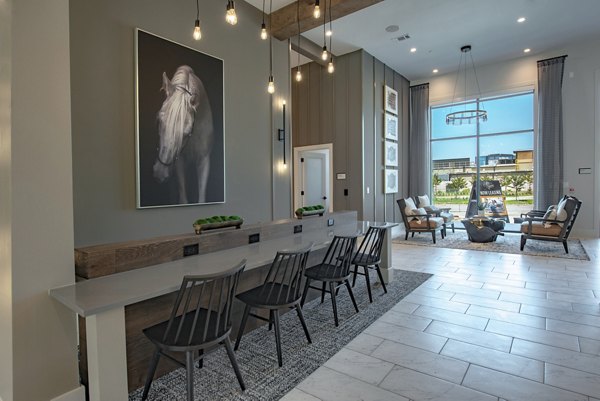Modern clubhouse with contemporary furnishings at Alta at the Farm Apartments