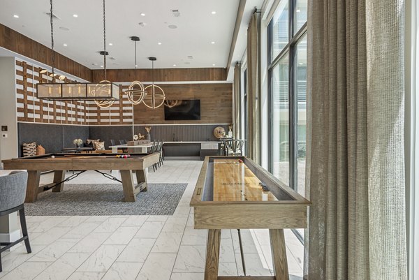 Clubhouse featuring stylish seating and modern design at Alta at the Farm Apartments