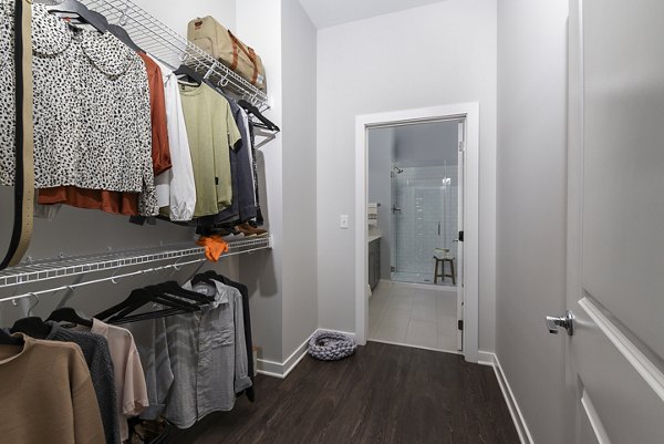 Spacious walk-in closet with built-in shelving in Alta Federal Hill Apartments