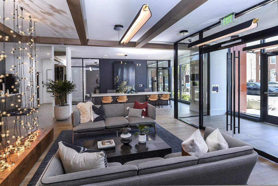 Clubhouse lounge featuring modern decor and comfortable seating at Alta Federal Hill Apartments
