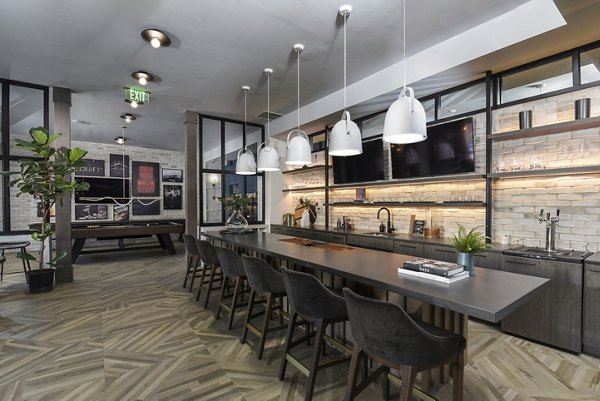 Chic clubhouse with modern furnishings at Alta Federal Hill Apartments, perfect for social events and relaxation