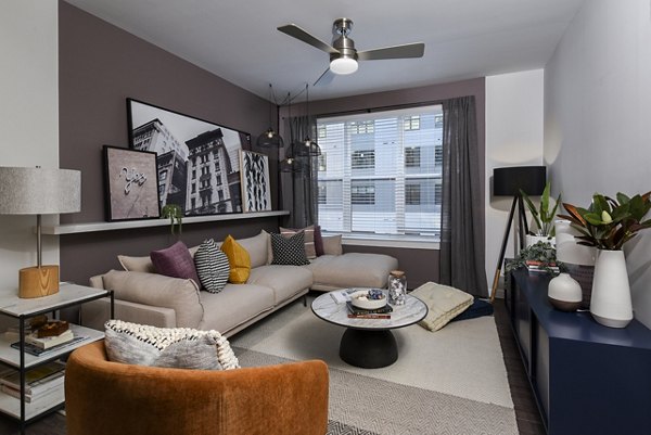 Spacious living room with modern furnishings in Alta Federal Hill Apartments