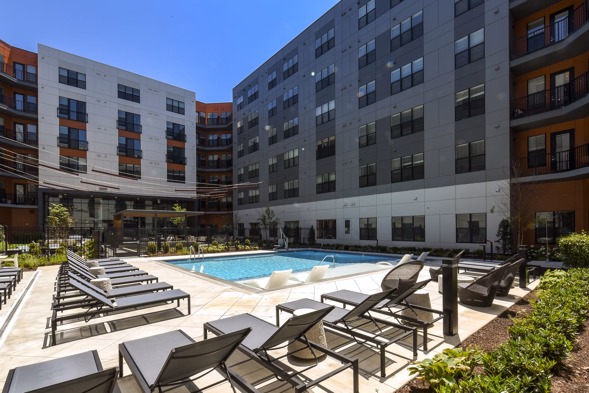 Alta Federal Hill Apartments: Inviting pool area with modern design and lounge seating
