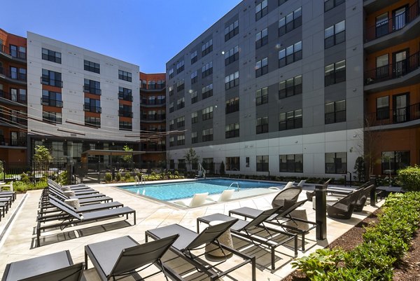 Alta Federal Hill Apartments: Inviting pool area with modern design and lounge seating